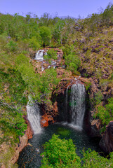Fototapeta na wymiar Three waterfalls cascading into a billabong in the Northern Territory Of Australia