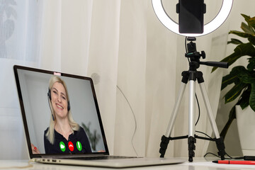 Fototapeta na wymiar laptop with videoconference stands on the table