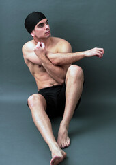 Obraz premium swimmer stretching arms after competing