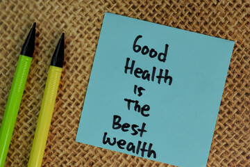 Good Health is the Best Wealth write on sticky notes isolated on Wooden Table.