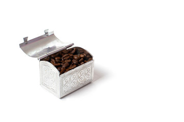 Roasted coffee beans in a small metal chest. Isolate on a white background. Copspace