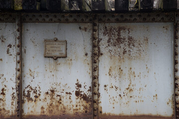 Mendota, Virginia.  February 9, 2021. American Bridge Company New York plaque.  U.S.A.  1908. Plaque on dilapidated railroad trestle on the under construction rails-to-trails system. Mendota Trail.