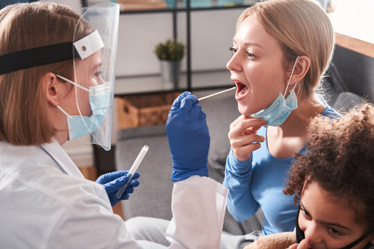 Medic taking sample from patients for coronavirus testing - Powered by Adobe