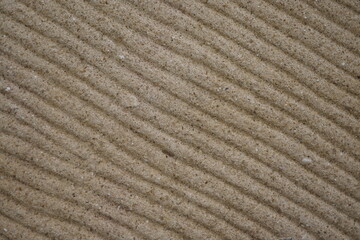 TEXTURA. MURO DE PIEDRA. ONDAS. COLOR CÁLIDO.