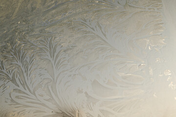 Frosty natural pattern at a winter window glass