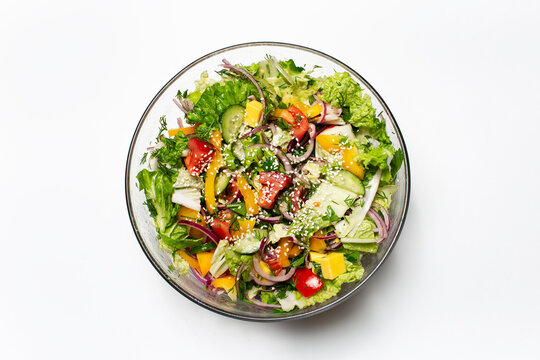 Top View Of Bowl With Green Salad On White Background.