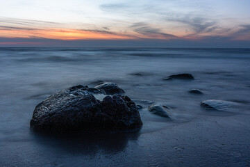 Fototapeta na wymiar rocks by the sea at sunset