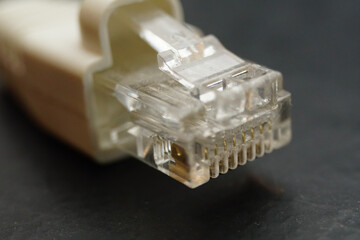 Closeup macro photo of the head of USB cable port plug with blurred background.
