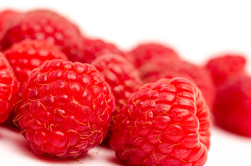 Appetizing red raspberry berries close up
