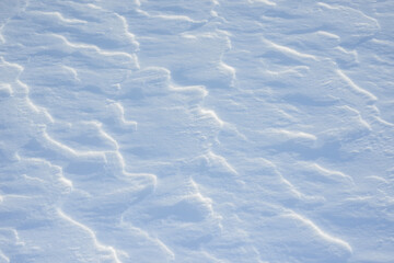 Fresh clean white snow background texture. Winter background with snowflakes and snow mounds. Snow lumps. Seasonal landscape details.
