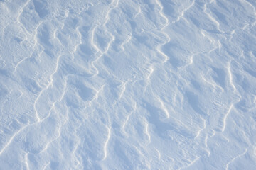 Fresh clean white snow background texture. Winter background with snowflakes and snow mounds. Snow lumps. Seasonal landscape details.