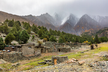 Stone buildings in Karakorum mountains cloudy weather 
