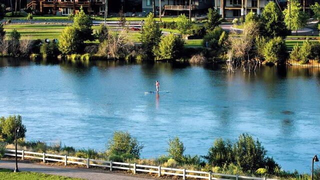 The Deschutes River in Bend , Oregon with paddle board.