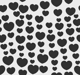 Endless seamless monochrome pattern of hearts of different sizes. Black and white vector hearts.