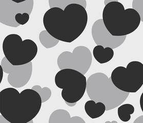 Fototapeta premium Endless seamless monochrome pattern of hearts of different sizes. Black and white vector hearts. Wallpaper for wrapping paper.