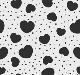 Fototapeta premium Endless seamless monochrome pattern of hearts of different sizes. Black and white vector hearts. Wallpaper for wrapping paper.