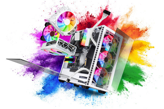 exploded view of white gaming pc computer with glass windows and rainbow rgb LED lights. Flying hardware components in front of abstract color powder explosion  isolated background