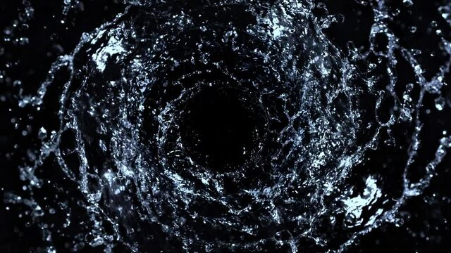 Super Slow Motion Shot of Rotating Water Splash Isolated on Black Background at 1000fps.