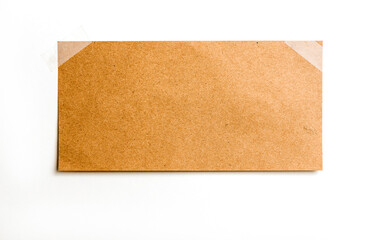 Vintage note paper on white background, attached by adhesive tape
