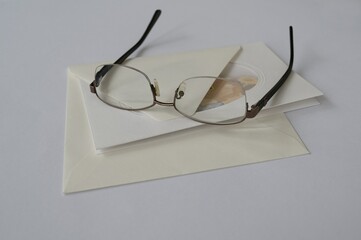 Still life - envelope, greeting card, and glasses,