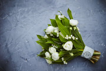 Top view of a delicate bouquet with white peonie on a grunge surface © Joong Yeul Lee/Wirestock