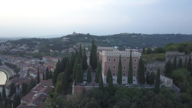 Center of Verona city in the evening from the sky. Aerial view of an ancient Italian city. 