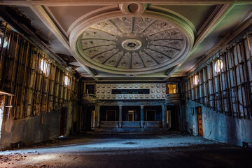 Fototapeta na wymiar Old creepy abandoned ruined empty theater hall