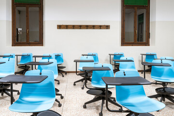 social distancing between school desks in an empty classroom