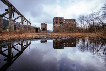 Fototapeten Verlassene Gebäude Overgrown ruins of industrial building. Abandoned, destroyed by war coal processing factory in Tkvarcheli Tquarhcal, Abkhazia, Georgia  © Mulderphoto