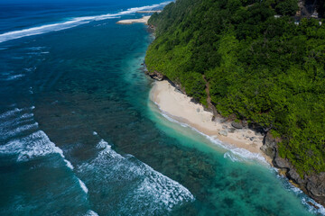 Aerial drone view of Green Bowl beach located on the Southern coast of Bali in Indonesia.