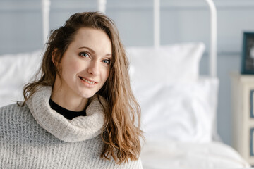 Naklejka premium woman in sweater have relax at home
