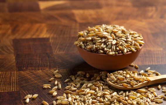 Freekeh Grain on a Dark Wooden Butcher Block