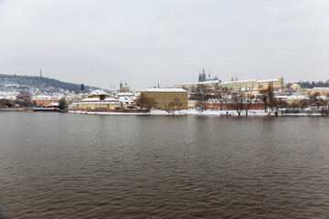 Fototapeta na wymiar Snowy Prague Lesser Town with Prague Castle above River Vltava, Czech republic