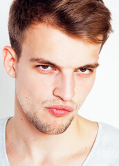 Obraz premium young handsome teenage hipster guy posing emotional, happy smiling against white background isolated, lifestyle people concept close up