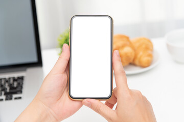 female hands holding phone with isolated screen in the coffee shop