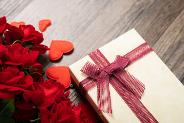 Selective focus roses and Gift box on wooden board, Valentines Day background, wedding day