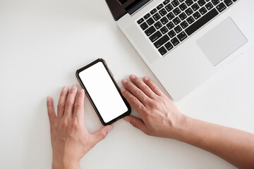 man sitting useing smartphone  and makes online shopping in a white room