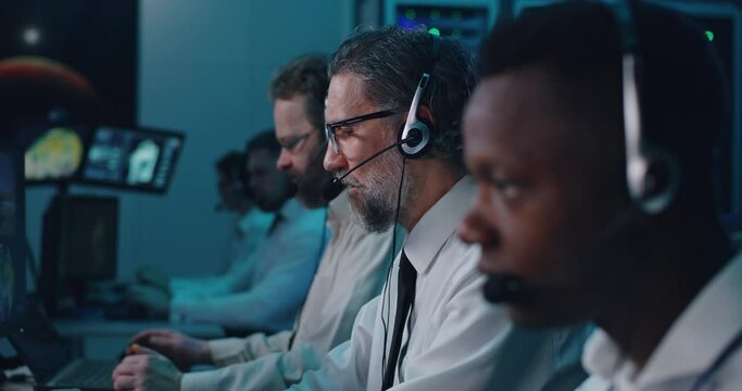 Male operators working in control center