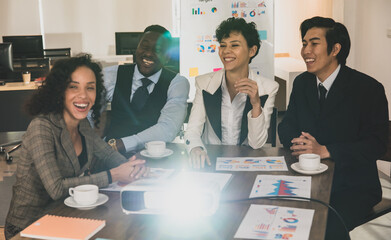 Businessmen and businesswomen Diversity of nationalities are attending the conference room with a smiling face and is projecting the projector to work at the office. Concept meeting show projector.