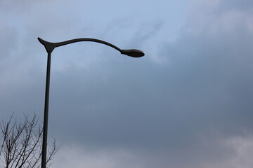 Images of cloudy skies and streetlights