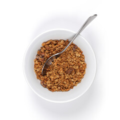 A white bowl of granola with spoon on white background with shadow