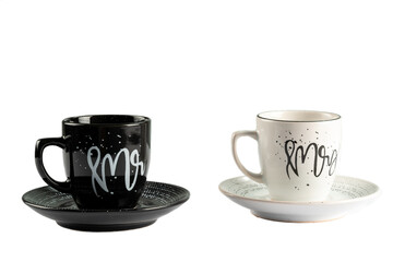 Porcelain black and white Mr. and Mrs coffee cup set isolated on the white background.