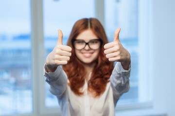 cheerful business woman gesturing with hands positive thumbs up professional manager