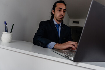 businessman doing work at home on the computer