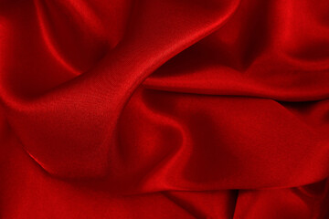 Dark red fabric texture background, detail of silk or linen pattern.