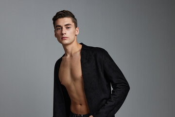 man in black jacket naked torso attractive look posing 