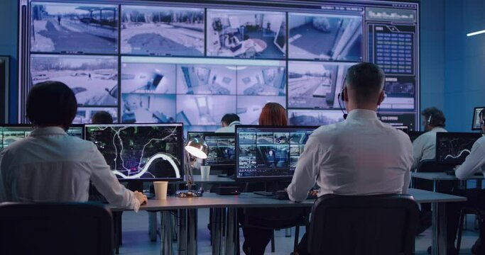 Surveillance team working in office