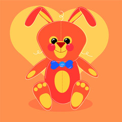 Toy orange rabbit on the background with a heart.