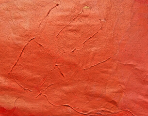 abstract  gouache  paint texture on canvas with embossed , orange coral paint strokes. Hand drawn gouache  painting.  Color texture. Fragment of artwork. Spots of paint. Brushstrokes of paint. Modern