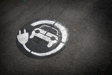 Fototapeta premium Electric vehicle charging station symbol on ground